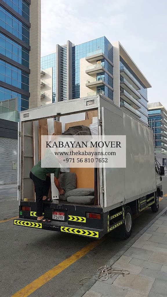 furniture movers abu dhabi loading transport truck for house relocation