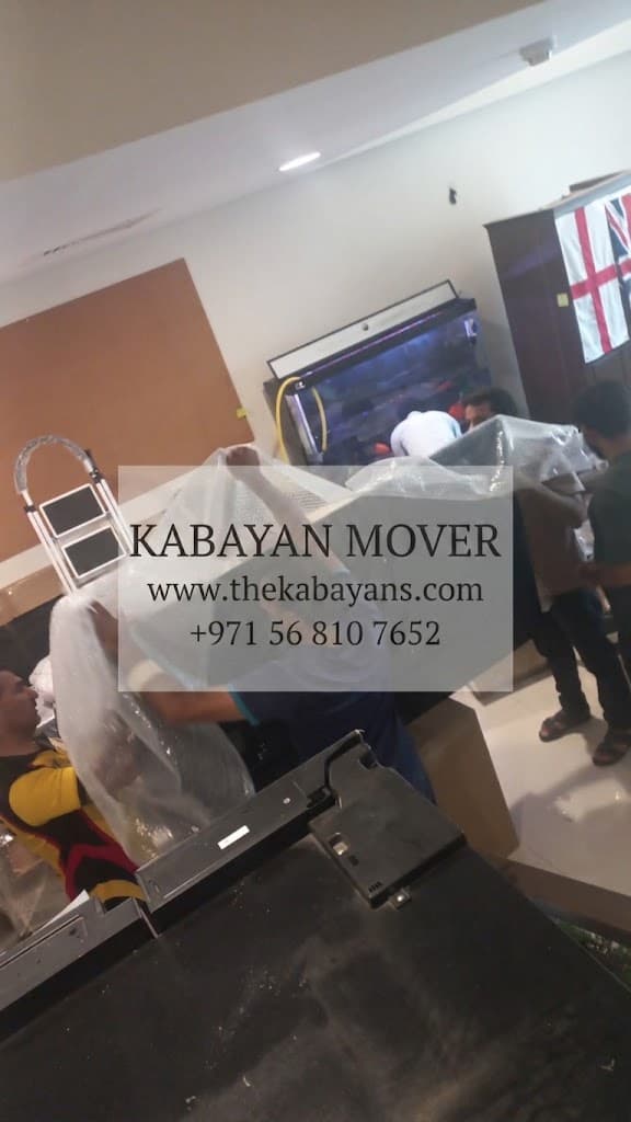 villa movers in dubai packing furniture with bubble wrap protection